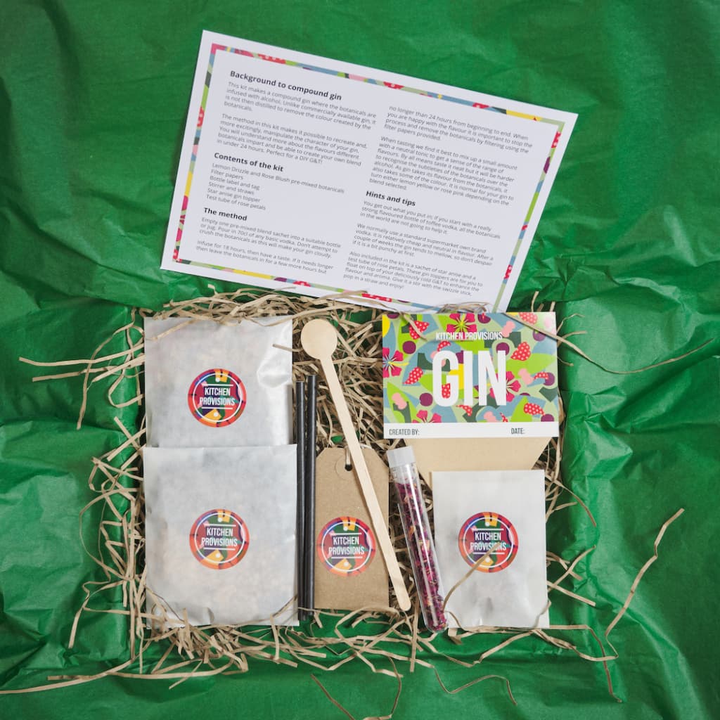 Letterbox Gin Making Kit - Mothers Ruin showing open contents unwrapped from green tissue paper