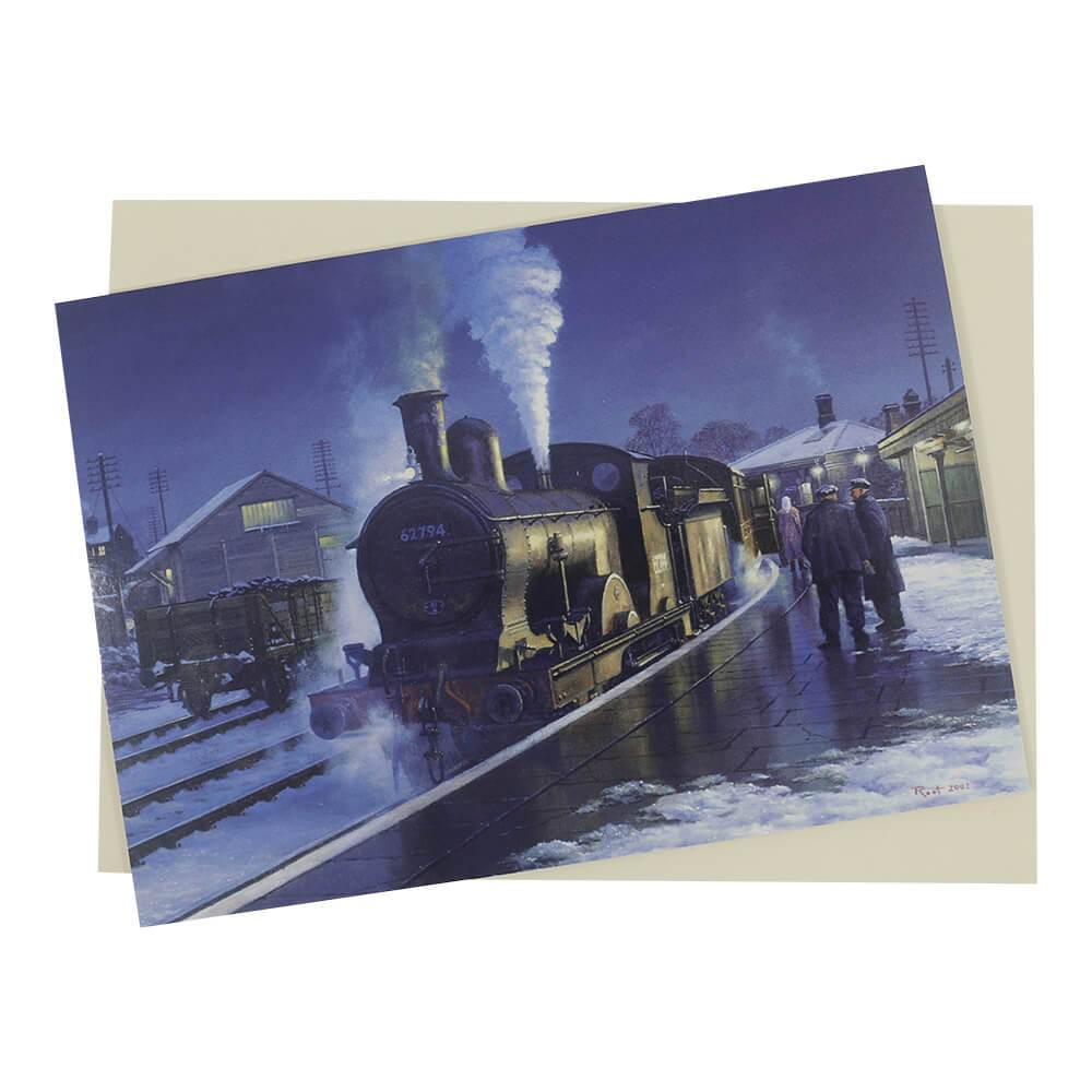 This vintage Steam Locomotive Christmas card features a nighttime scene of an LNER E4 Class 62794 engine at a small, snow, and ice-covered station.
